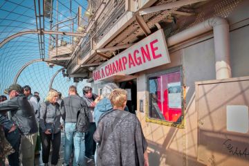 Visitors at the champagne shop located on top of the Eiffel tower Visitors at the champagne shop located on top of the Eiffel tower