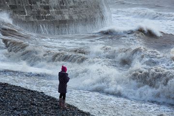 Waves breaking over the Cobb at Lyme Regis, Dorset, England Waves breaking over the Cobb at Lyme Regis, Dorset, England
