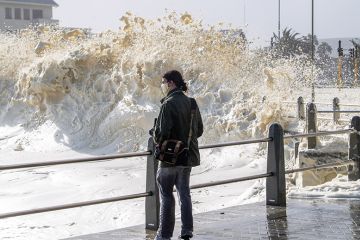 Strong winds blow large puffs of foam off the sea and into the streets of Sea Point on July 13, 2020 in Cape Town, South Africa Strong winds blow large puffs of foam off the sea and into the streets of Sea Point in 2020 in Cape Town, South Africa