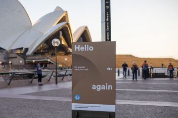 A sign welcomes people back outside the Sydney Opera House in Sydney, Australia A sign welcomes people back outside the Sydney Opera House in Sydney, Australia to illustrate ‘Give people time’ to readjust from pandemic, says Jackson