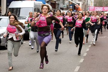 Women run down Amsterdam's most famed fashion street in stiletto heels to illustrate Dutch universities blocked from using gender quotas in admissions