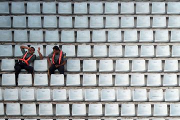 Officials sit among empty benches during the ninth match of the Asia Cup one-day cricket tournament Officials sit among empty benches during the ninth match of the Asia Cup one-day cricket tournament to illustrate Indian PhD diaspora leaves universities short of recruits