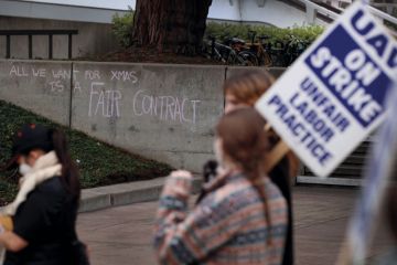 A message is written on a wall as University of California picketers protest at University of California A message is written on a wall as University of California picketers protest at University of California to illustrate California ‘reclassifies workers to duck pay rises’ won in strike
