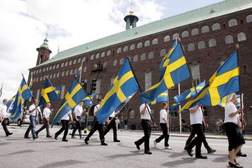 Extreme-right nationalists march in front of the Stockholm City Hall to illustrate Sweden split on how to handle right-wing student’s ‘harassment’