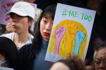 A demonstrator holds a sign reading "#Me Too" during a rally against sexual harassment in Shinjuku, Tokyo A demonstrator holds a sign reading "#Me Too" during a rally against sexual harassment in Shinjuku, Tokyo to illustrate Japanese universities ‘behind the times’ on sexual harassment