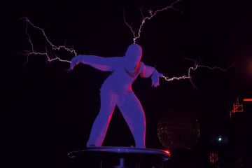 A dancer throwing live electric lightning bolts to illustrate Russell Group universities contemplate overseas student ‘shocks’