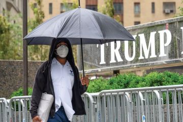 A person wears a protective face mask outside Trump International Hotel & Tower New York A person wears a protective face mask outside Trump International Hotel & Tower New York
