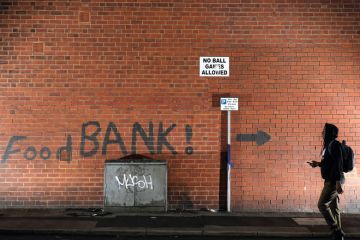 A sign painted on the side of a house directs people to a local food bank A sign painted on the side of a house directs people to a local food bank to illustrate Halfon: ‘No way I’ll support raising fees’