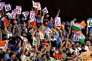 India fans cheer during the men's World Cup to illustrate IITs: Can the Indian premier league thrive on the international stage?