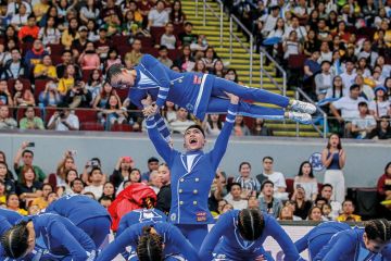 Cheering squad from the Ateneo De Manila University perform Cheering squad from the Ateneo De Manila University perform to illustrate Fee-free Philippines degrees ‘threaten the viability of the private sector’