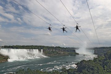 People ride a zip line on the Canadian side of the Niagara River People ride a zip line on the Canadian side of the Niagara River to illustrate Canada ‘may fall short of caps’ as overseas interest nosedives