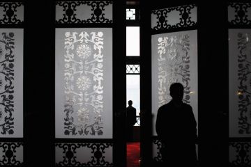 A security officer stands guard at the main entrance of the Great Hall of the People in Beijing, China. A security officer stands guard at the main entrance of the Great Hall of the People in Beijing, China to illustrate fears grow over missing academics