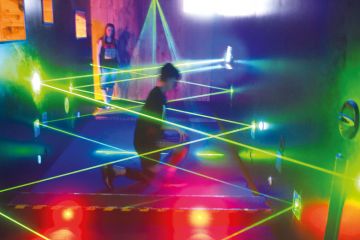 A visitor tries to walk through a security parcour out of laser motion sensors A visitor tries to walk through a security parcour out of laser motion sensors to illustrate HE ties to hacking ‘not surprising’