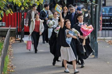 An Asian graduate from Imperial College London holds a Lego aircraft model An Asian graduate from Imperial College London holds a Lego aircraft model to illustrate Public wary of growing overseas student numbers as views shift