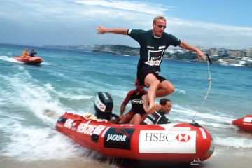 Eddie Irvine of Northern Ireland jumps from a IRB rescue boat onto Bondi Beach, Sydney Eddie Irvine of Northern Ireland jumps from a IRB rescue boat onto Bondi Beach, Sydney to illustrate Australian universities redraw casual employment as law comes in