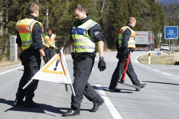 German police guards secure an access road German police guards secure an access road to illustrate Language barrier holds back international academics in Germany