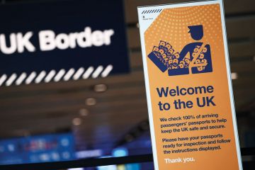 UK border signage is pictured at the passport control in Arrivals to illustrate Can the UK be a science superpower with super-high immigration fees?