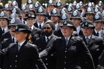 Newly qualified Metropolitan police officers take part in their Passing out Parade to illustrate End of obligatory degrees for police ‘backward step’
