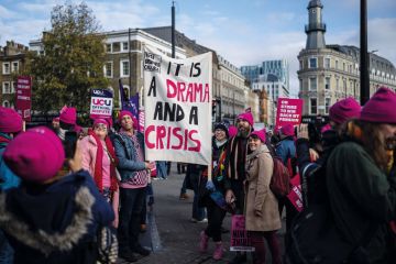 Protesters take part in a union rally  by the University and College Union (UCU) amid strike action by staff to illustrate Eight per cent rise would end strikes, say labour experts