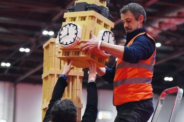 An exhibitor puts the finishing touches to a model of the Houses of Parliament's Elizabeth Tower (Big Ben) made from Lego An exhibitor puts the finishing touches to a model of the Houses of Parliament's Elizabeth Tower (Big Ben) made from Lego to illustrate Embedded inside parliament, influence of academics grows