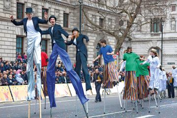 Circus taking part in London's  New Year's Day Parade, Whitehall, London England, to illustrate Who should pay to fill  fee deficit, students or the public?