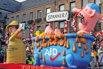 Carnival float depicting the secret service spying on right-wing party AfD in Dusseldorf. to illustrate German universities could be ‘less attractive’ as far right rises