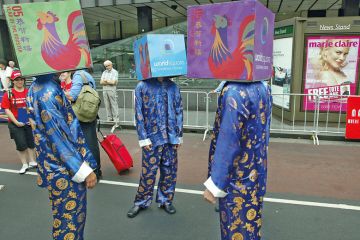 A group of performers cover their heads with boxes in Sydney, Australia A group of performers cover their heads with boxes in Sydney, Australia to illustrate Excessive secrecy ‘undermining security’ of Australian research