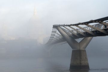 Millennium Footbridge in front of St Paul's Cathedral disappearing into the mist to illustrate ‘Significant reservations’ on UK’s Springer Nature open-access deal