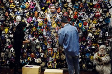 Chinese man camouflaged with painted masks on his body Chinese man camouflaged with painted masks on his body to illustrate What next for US-China research ties post-Lieber?