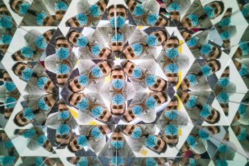 Kaleidoscope effect of a man wearing a face mask to illustrate Reflections on the REF