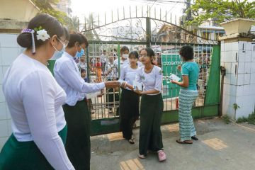 Students enter a high school for the matriculation exam as explained in the article