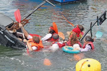 Boat sinking at the Cardboard Boat Regatta at Port-Rhu in Douarnenez, France Boat sinking at the Cardboard Boat Regatta at Port-Rhu in Douarnenez, France to illustrate French funding cuts ‘contradict’ Macron’s research pledge