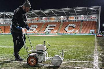 Ground staff paints the white lines of the football pitch in Blackpool Ground staff paints the white lines of the football pitch in Blackpool to illustrate What can academics and universities learn from Jo Phoenix’s employment tribunal victory