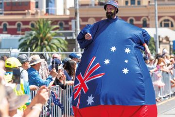 Man in inflated costume with an Australian flag Man in inflated costume with an Australian flag to illustrate Some Australian campuses ‘earn more from locals than foreigners’