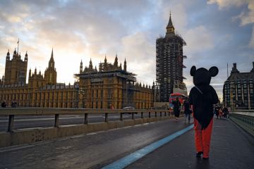 A man in a Mickey Mouse costume walks past the Houses of Parliament, London, United Kingdom A man in a Mickey Mouse costume walks past the Houses of Parliament to illustrate ‘Mickey Mouse degrees’ rhetoric expected to survive Tory rebuild