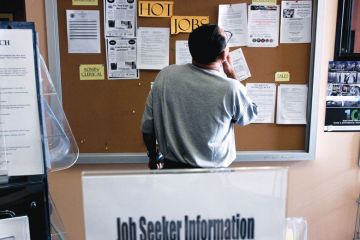 A job seeker looks at postings for jobs at the Verdugo Jobs Center, which includes a California Employment Development satellite office A job seeker looks at postings for jobs at the Verdugo Jobs Center, which includes a California Employment Development satellite office