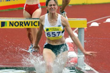 Clare Martin leads getting soaked while in the 2000 metre steeplechase Norwich Union World Trials to illustrate How a soaring deficit brutalised UEA’s modernising ambitions