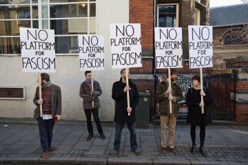 Protesters gather outside Cambridge University's Student Union holding banners reading 'No platform for fascism' Protesters gather outside Cambridge University's Student Union holding banners reading 'No platform for fascism'