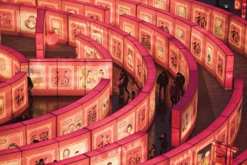  Chinese people walk in a maze at the Tang Paradise Park in Xian