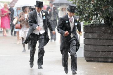 Racegoers in top hats run for cover during a torrential rain Racegoers run for cover during a torrential rain to illustrate Golden triangle research ‘no more golden than rest of UK