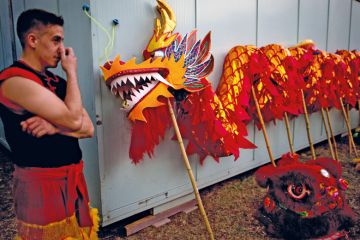 A dancer stands next to a dragon held up with poles in Buenos Aires, Argentina A dancer stands next to a dragon held up with poles in Buenos Aires, Argentina to illustrate Fees for foreign students ‘a sign of what’s to come’ in Argentina