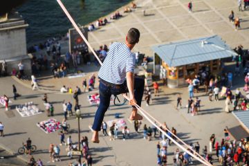 Tightrope walker Nathan Paulin traverses a slackline between the Eiffel Tower and the Trocadero Square Tightrope walker Nathan Paulin traverses a slackline between the Eiffel Tower and the Trocadero Square to illustrate French universities avoid worst in election but face uncertainty