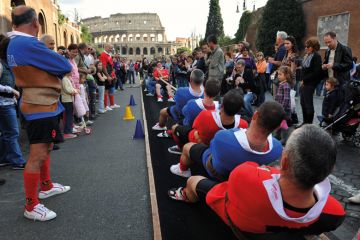 Traditional tug-of-war game near the ancient Colosseum in Rome Traditional tug-of-war game near the ancient Colosseum in Rome to illustrate Italy mandates live delivery and staff ratios for online degrees