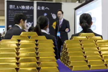 University students listen to a company recruiter at a job fair at Tokyo University students listen to a company recruiter at a job fair at Tokyo to illustrate Japan seeks to improve salary prospects for PhD graduates