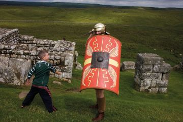 Re-enactment soldier at Housesteads Fort on Roman Hadrian's Wall, to illustrate Universities shun school mentoring ‘to guard global reputation’