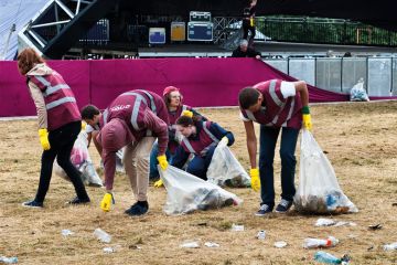 A team of litter pickers clearing up the morning after a music festival - Wilderness, Cornbury, Oxfordshire, UK A team of litter pickers clearing up the morning after a music festival - Wilderness, Cornbury, Oxfordshire, UK to illustrate Time to bin all REF open access rules, say Oxford research chiefs