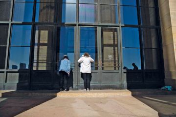 Visitors look inside the closed Philadelphia Museum of Art Visitors look inside the closed Philadelphia Museum of Art to illustrate Private US college closures look to gain public attention