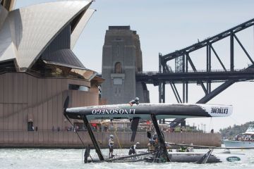 SYDNEY, AUSTRALIA - DECEMBER 11: LINO SONEGO - Team Italia catamaran skippered by Enrico Zennaro (ITA) capsizes after being hit by a gust during racing in Sydney Harbour SYDNEY, AUSTRALIA - DECEMBER 11: LINO SONEGO - Team Italia catamaran skippered by Enrico Zennaro (ITA) capsizes after being hit by a gust during racing in Sydney Harbour