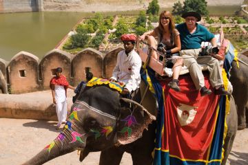 Tourists on holiday having colorful elephant rides at Amber Fort in Rajasthan Jaipur India Tourists on holiday having colorful elephant rides at Amber Fort in Rajasthan Jaipur India to illustrate Southampton wants 5,000 students at ‘comprehensive’ India campus
