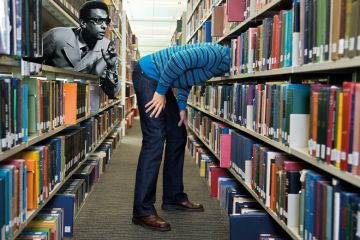 Montage of a library person with head deep in shelf and another person leaning out of a shelf to illustrate Librarians need the knowledge and willpower to challenge decolonisation